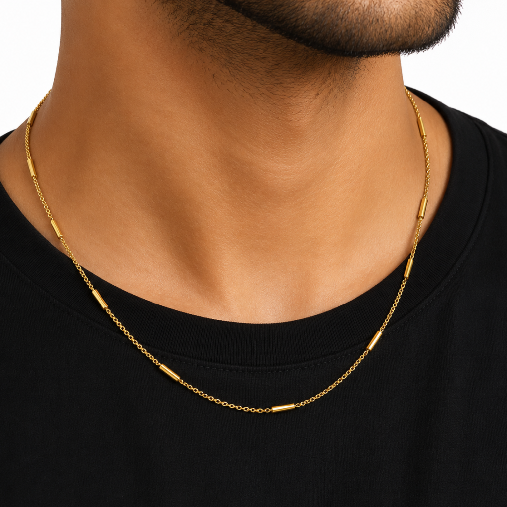 Men wearing the Nova Bar Chain with polished gold-tone bar accents and a minimalist design.