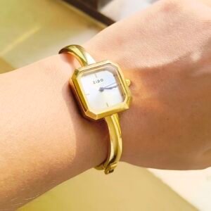 Elegant gold square bangle watch for women with a minimalist white dial and polished bracelet.