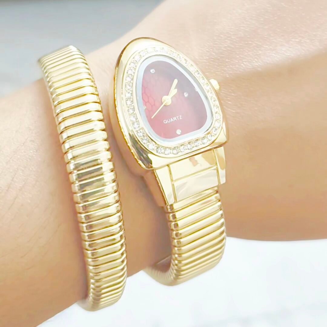 Rose Glow Serpent Watch with pink dial and gold snake strap for women