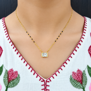 Golden Radiance Solitaire Mangalsutra with rectangular crystal pendant and black beads