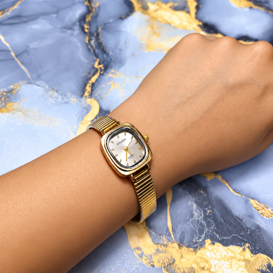 Golden Aura Classic Watch with white dial and gold-tone bracelet for women