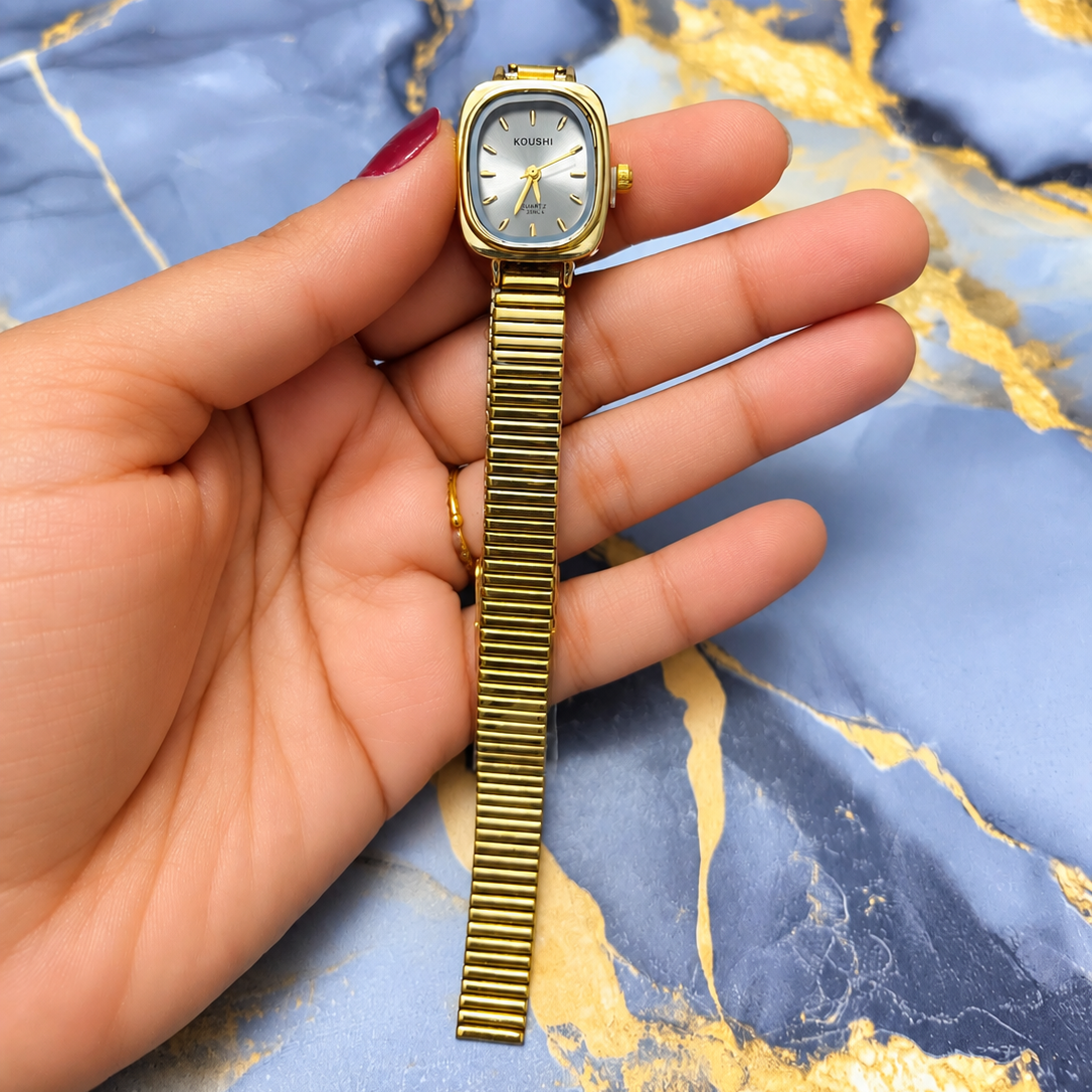Golden Aura Classic Watch with white dial and gold-tone bracelet for women