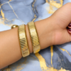 Emerald Luxe Serpent Watch with green dial, gold-tone wrap-around bracelet and crystal detailing for women